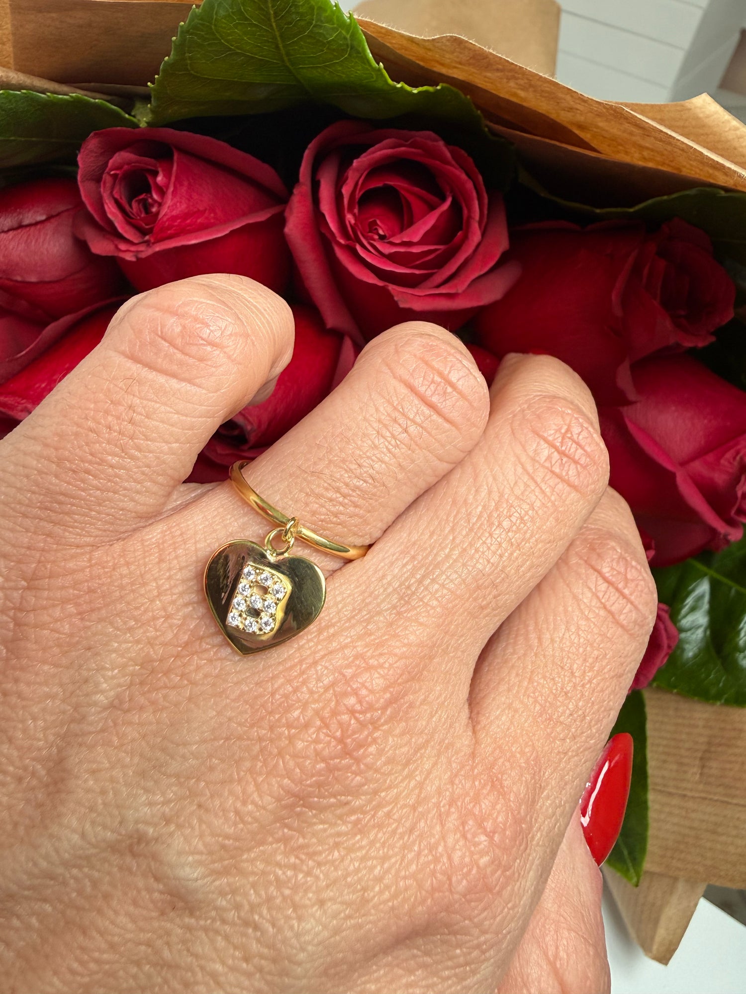 Anello con cuore pendente